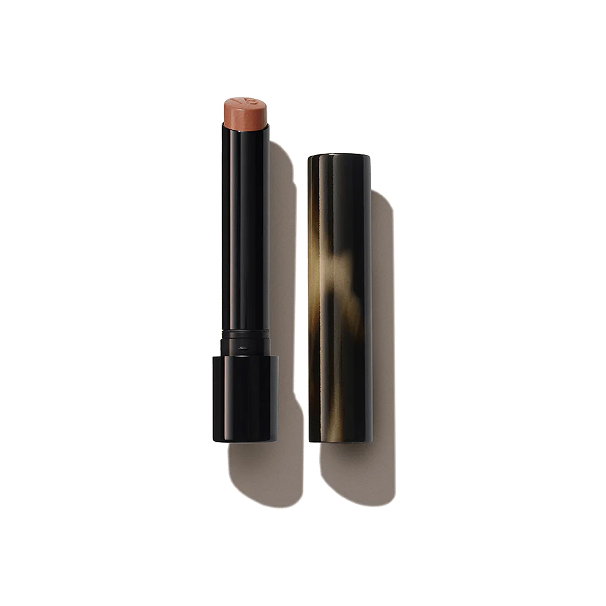 A Victoria Beckham Beauty Posh Lipstick in the shade 'Spice', with the cap removed, showing a mid-tone ginger color.