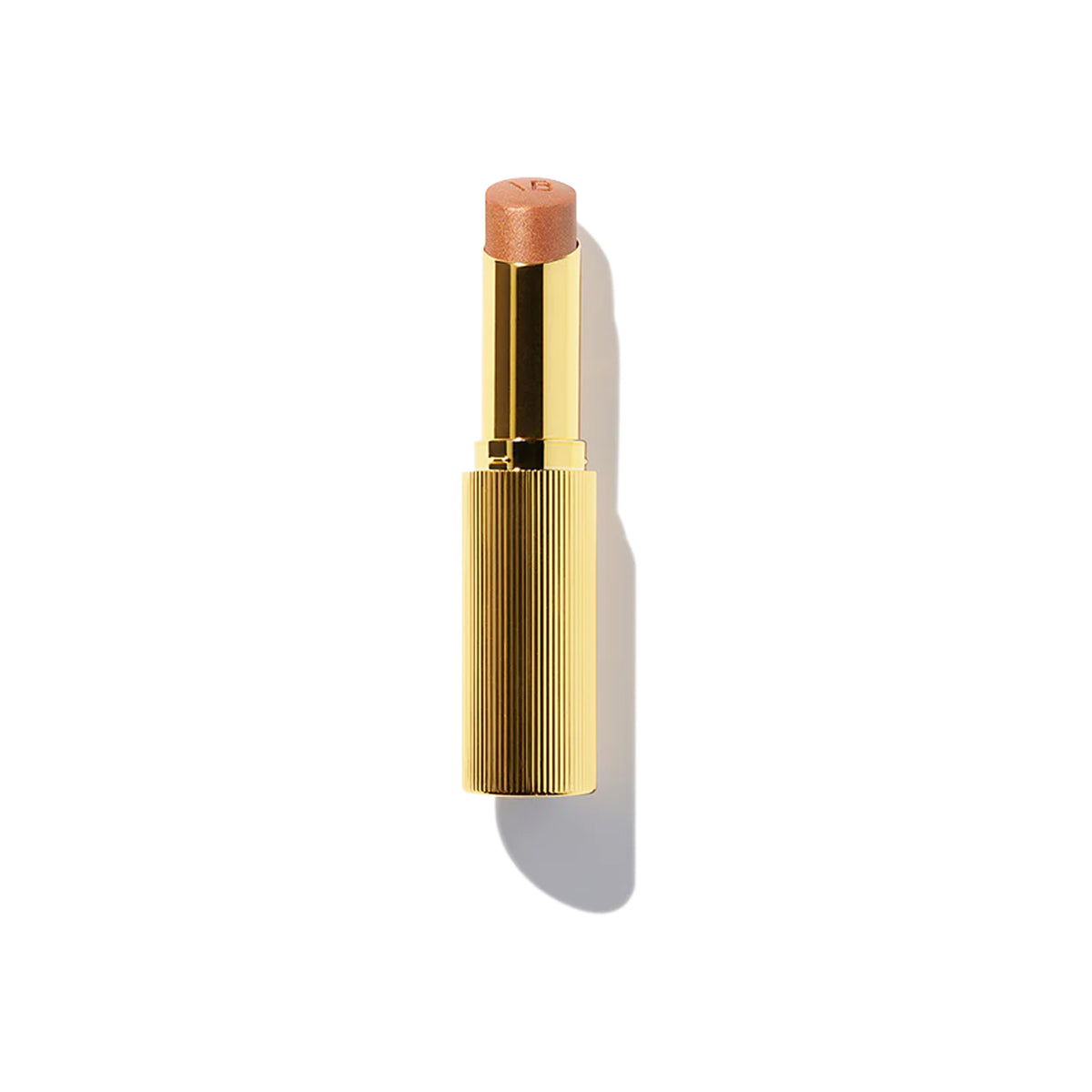 A gold designer case containing a highlighter stick with a bronze color tone.