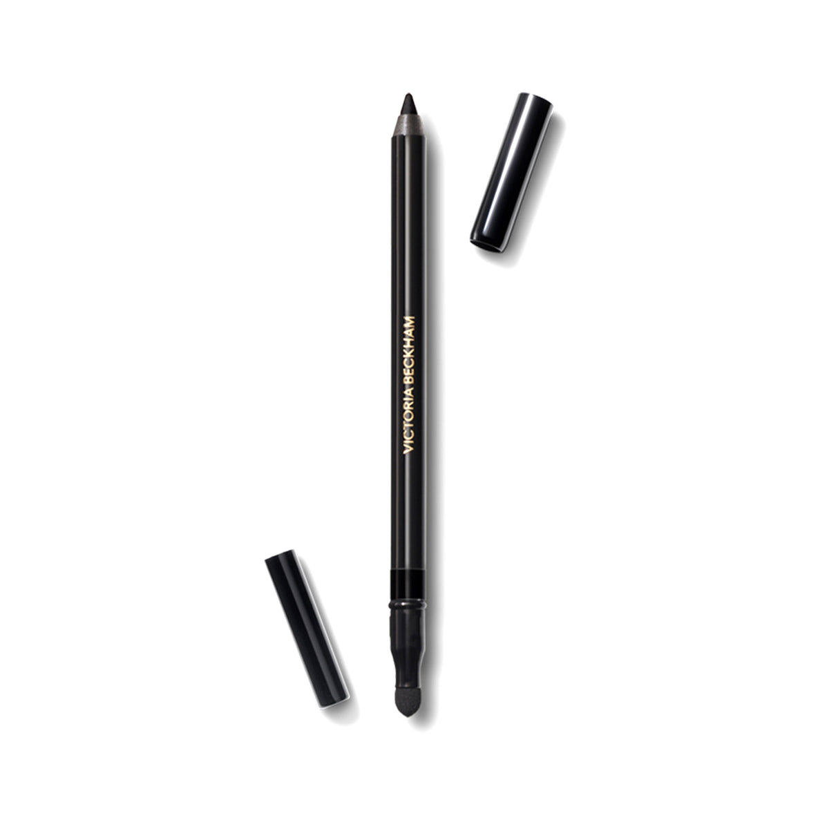 A black Victoria Beckham Beauty Satin Kajal Liner pencil with the cap off, showing the sharp, black tip.