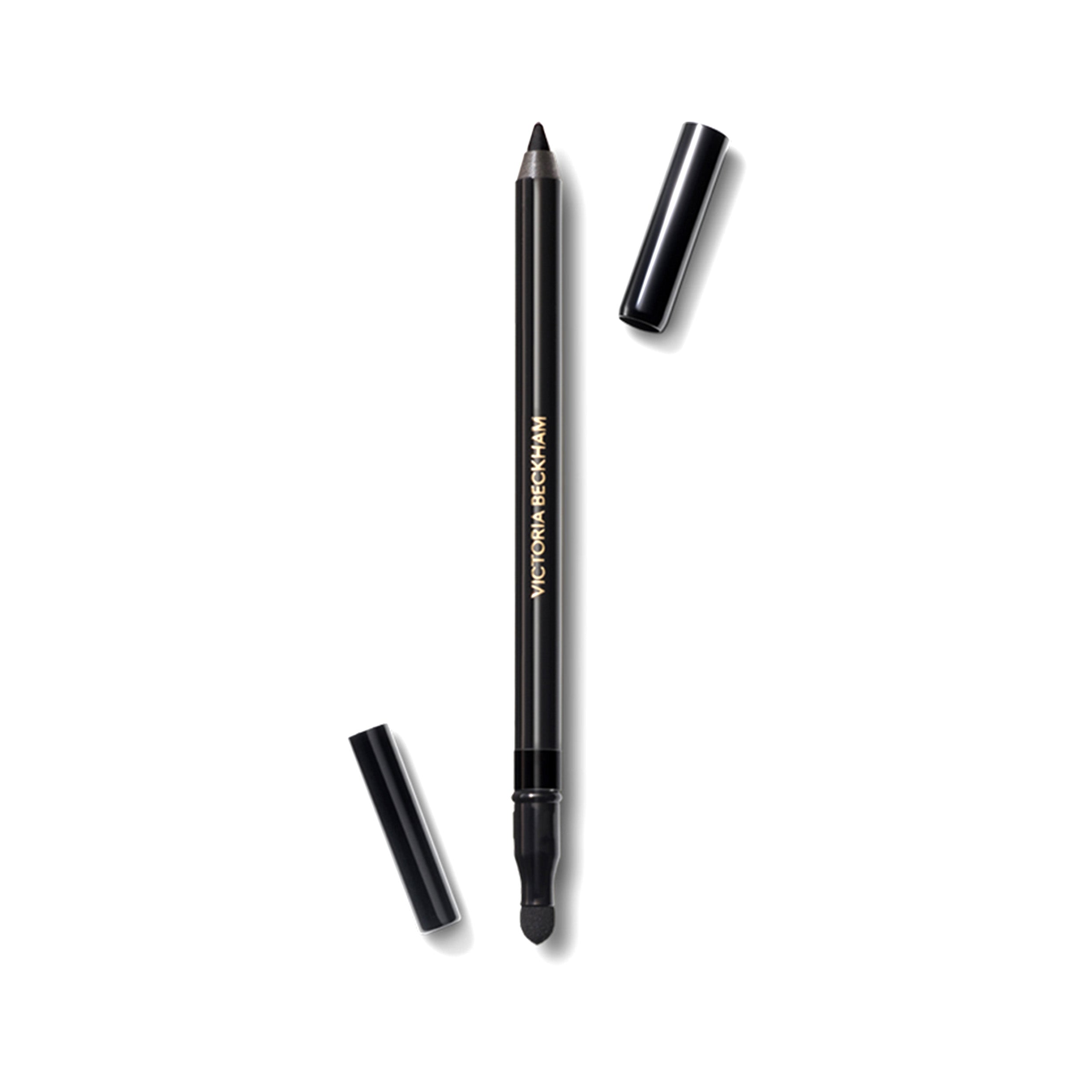 A black Victoria Beckham Beauty Satin Kajal Liner pencil with the cap off, showing the sharp, black tip.