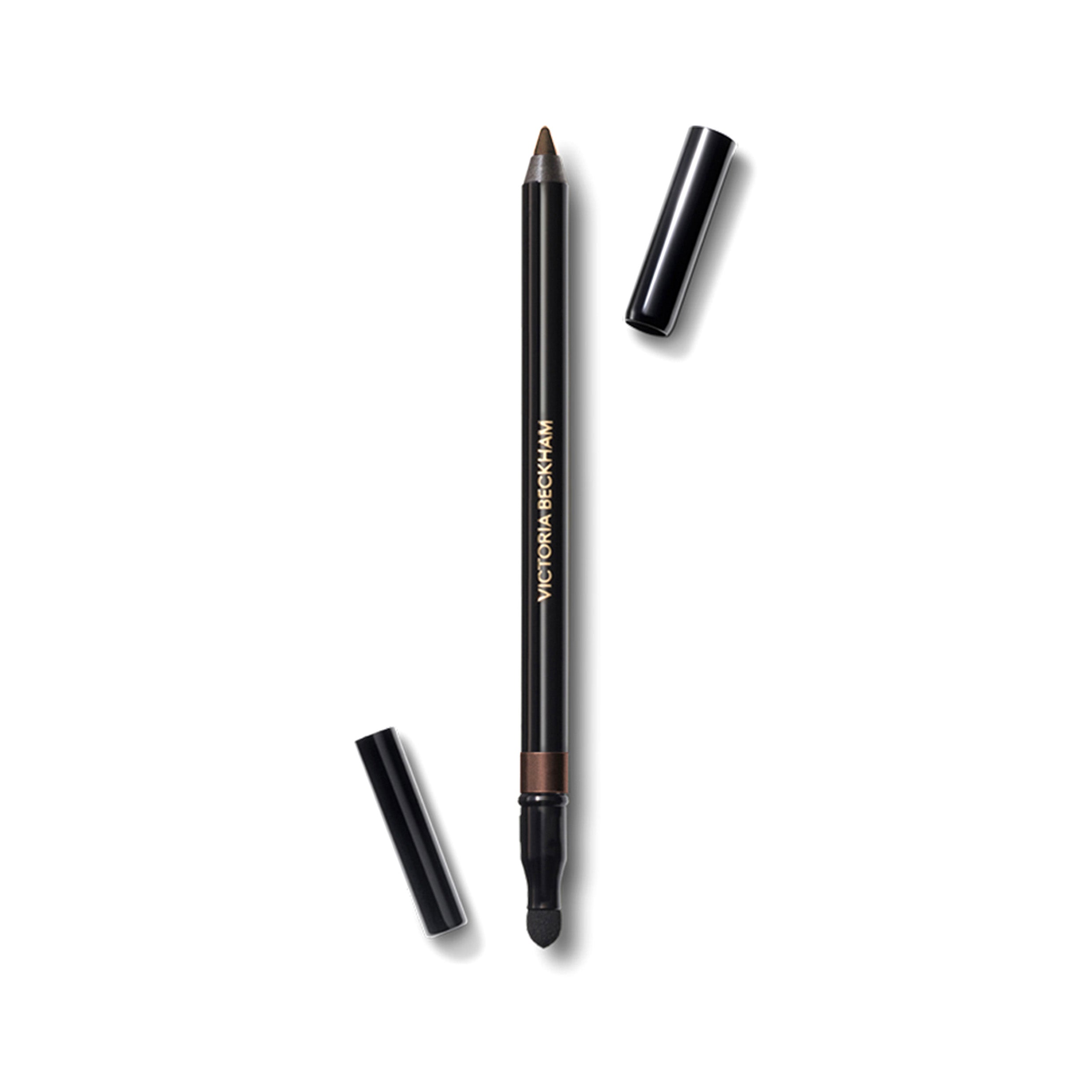 A Victoria Beckham Beauty Satin Kajal Liner in color Cocoa, with the cap off, showing the brown eyeliner pencil and the smudger tool.