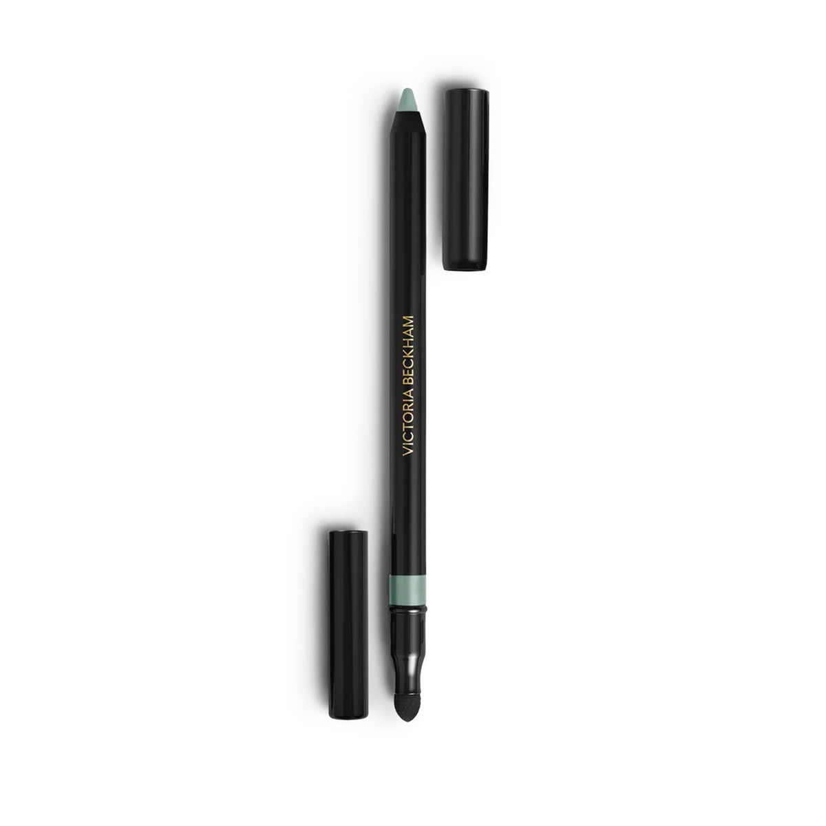 A Victoria Beckham Beauty Satin Kajal Liner in Seafoam color, with the cap off, showing the matte pastel green eyeliner and the smudger.