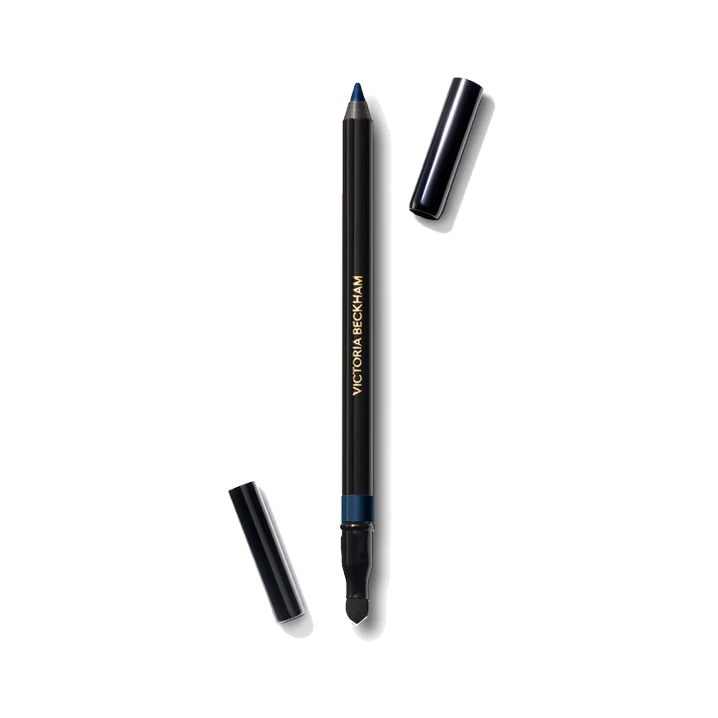 A Victoria Beckham Beauty Satin Kajal Liner in a rich matte teal color, with the cap off, showing the eyeliner pencil and the included smudger.