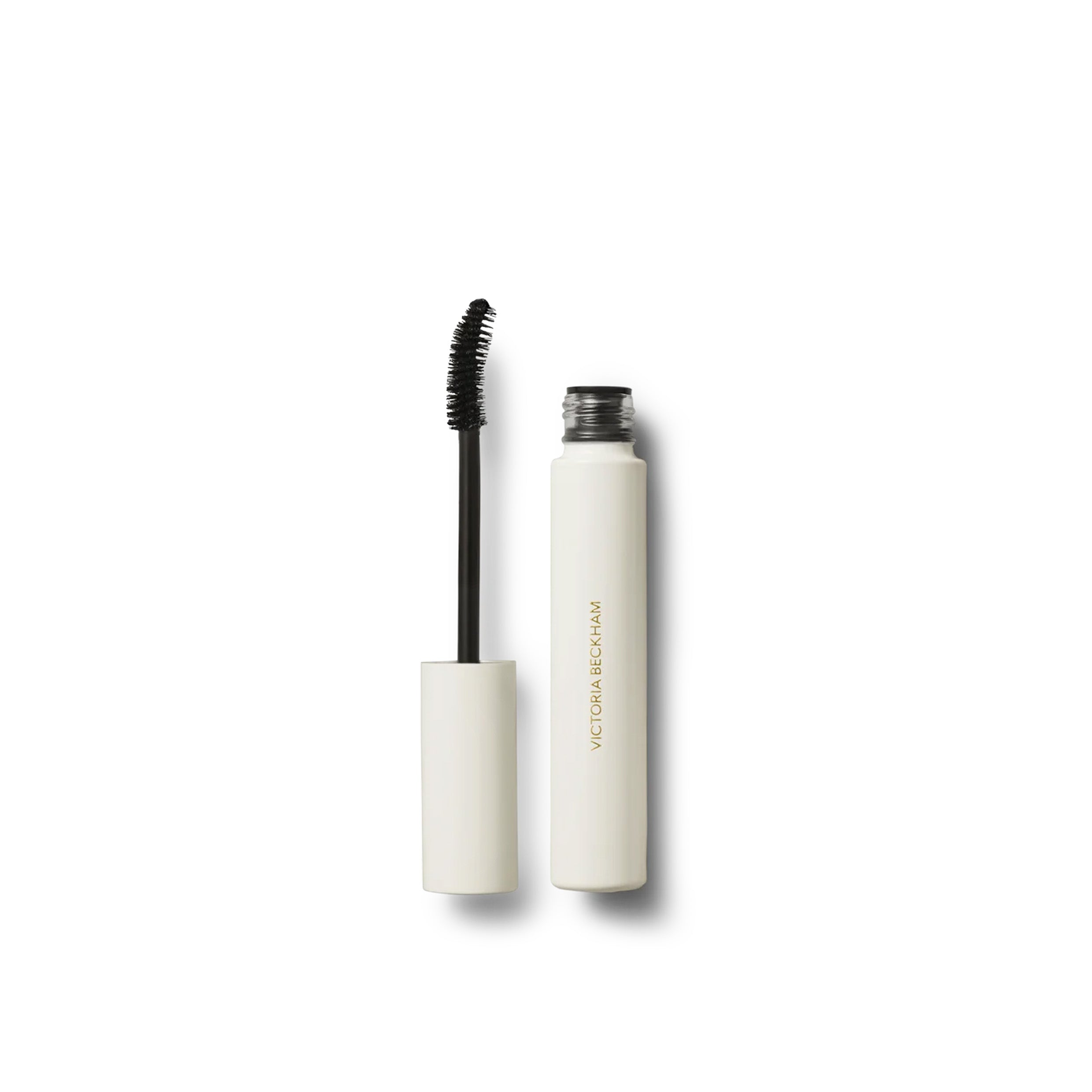 Open tube of Victoria Beckham Beauty Vast Lash Mascara with the wand applicator, showing the product packaging and design.
