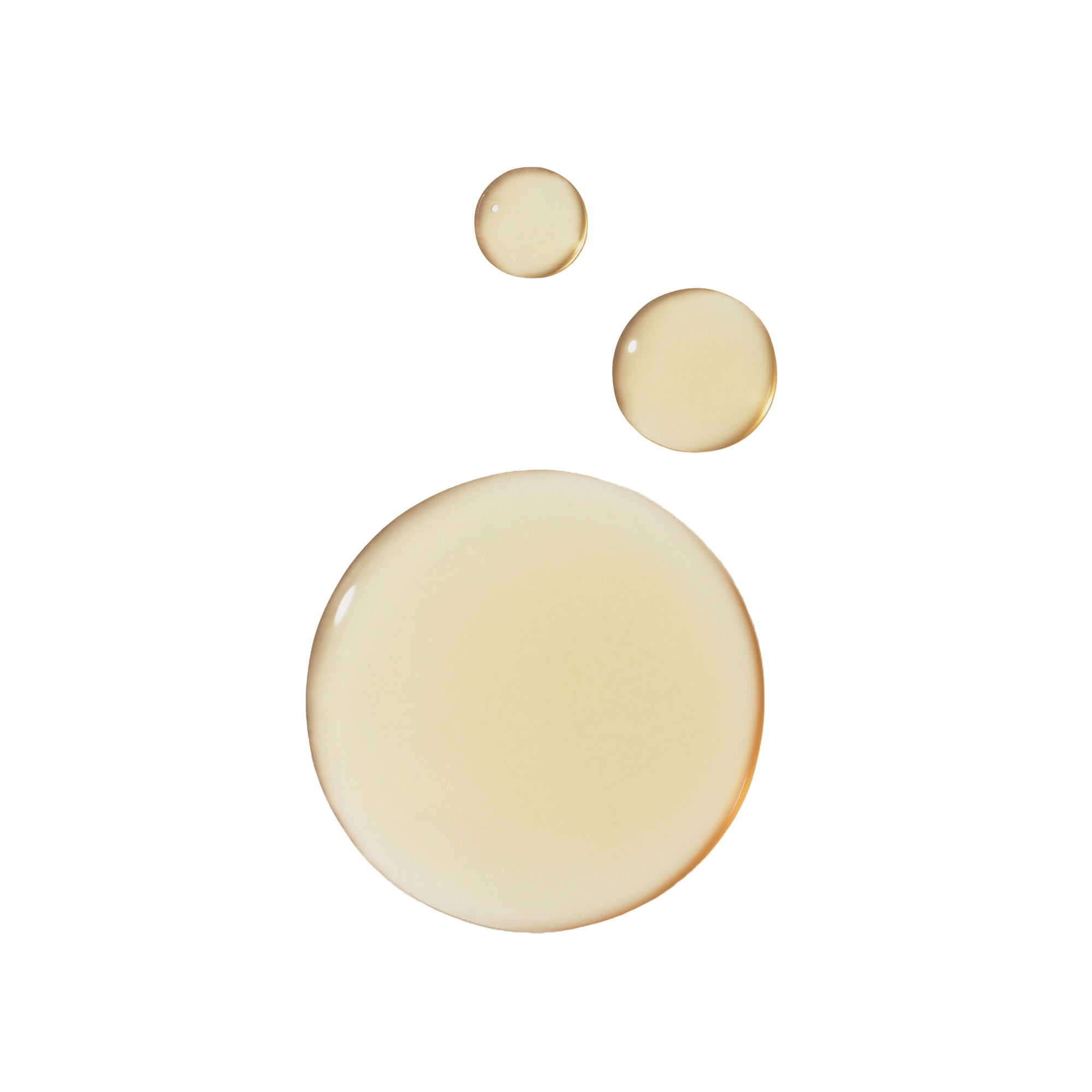 Three droplets of pale yellow liquid on a white background