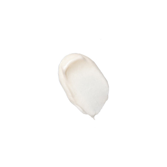 A product swatch of white face cream shown on a white background.